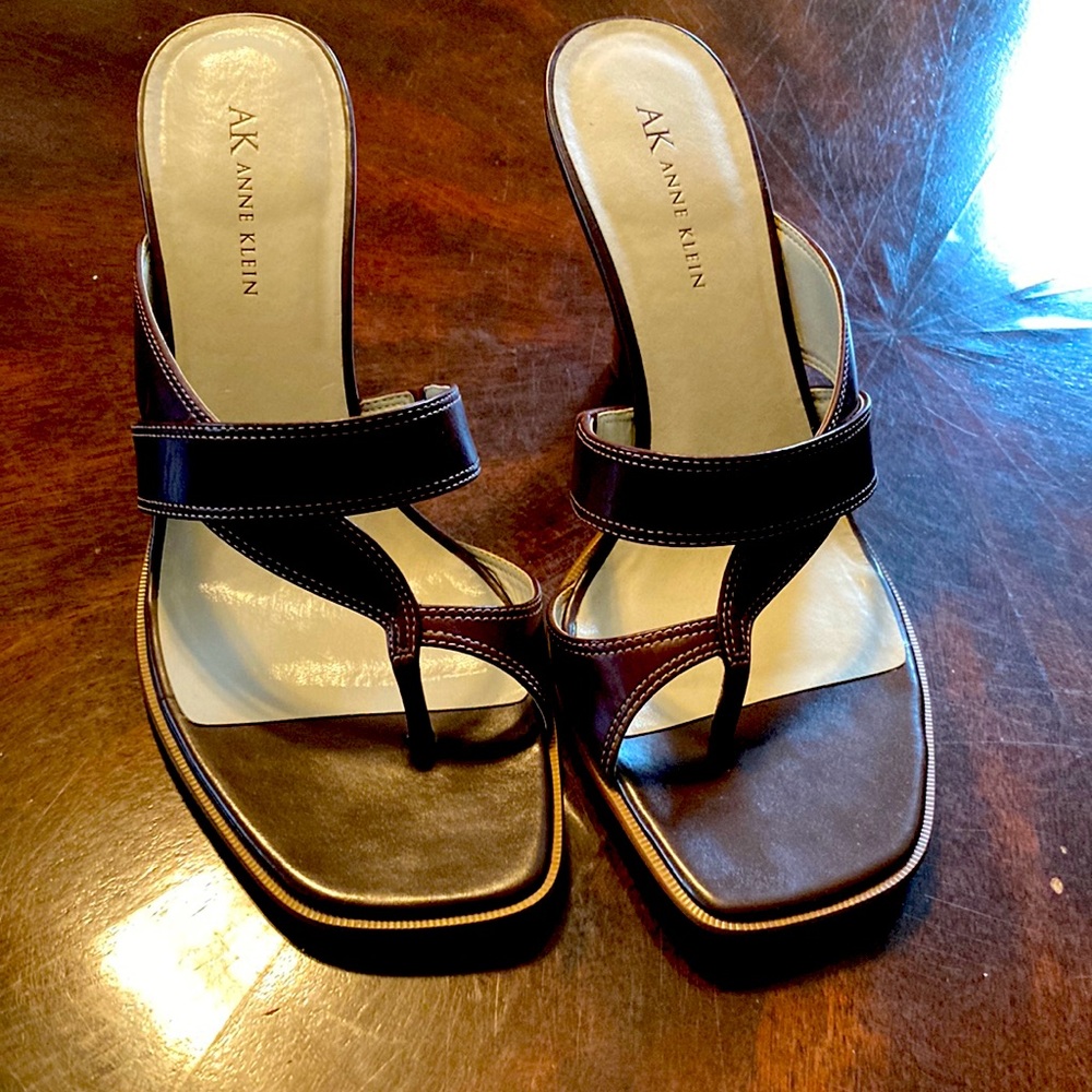 Dark brown sandals with a 3 1/2” heel.